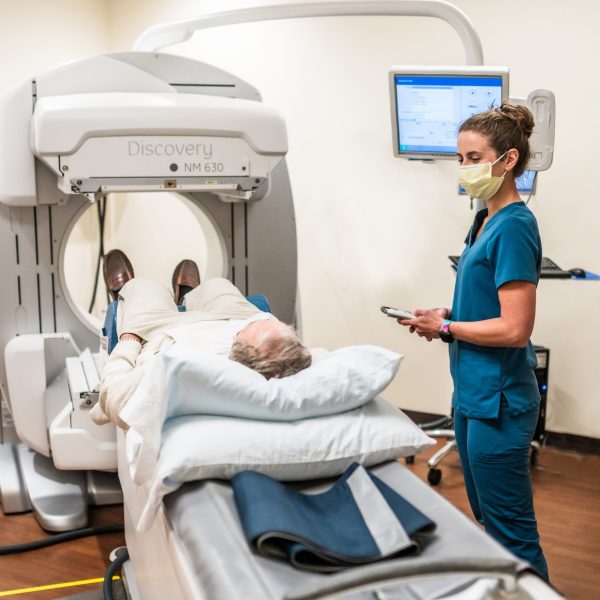 Provider and patient with imaging machine.