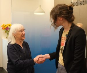 Senator Patty Murray and Dr. Sabrine Prime shake hands.